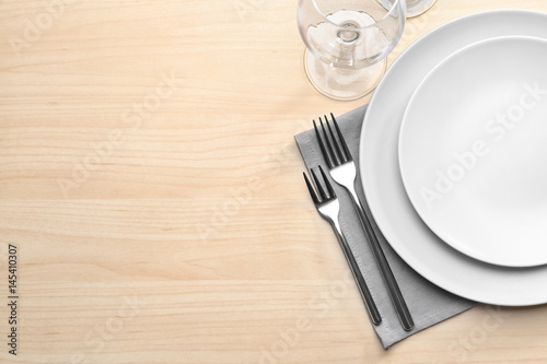 Table setting on wooden background