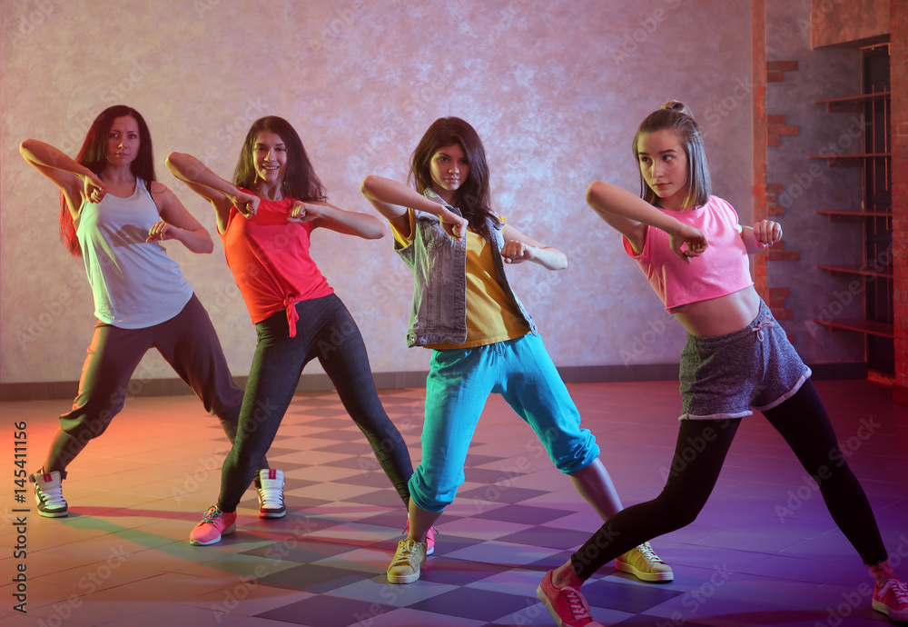 Fototapeta premium Group of young hip-hop dancers in studio