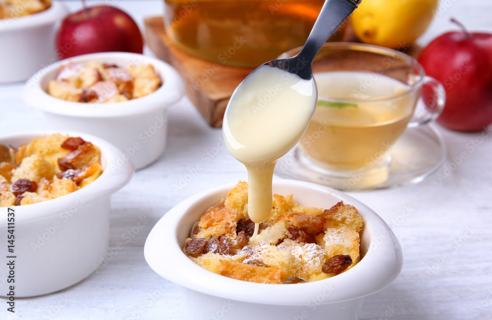 Delicious bread pudding with raisins on table Delicious bread pudding with raisins on table