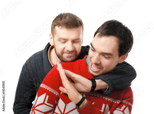 Happy gay couple posing on ...