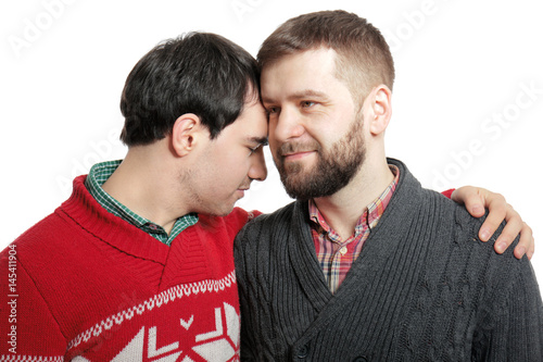 Happy gay couple posing on ...