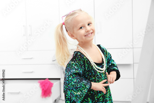 Cute little girl wearing mo...