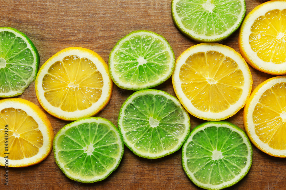 Sliced citrus fruits on wooden background Sliced citrus fruits on wooden background