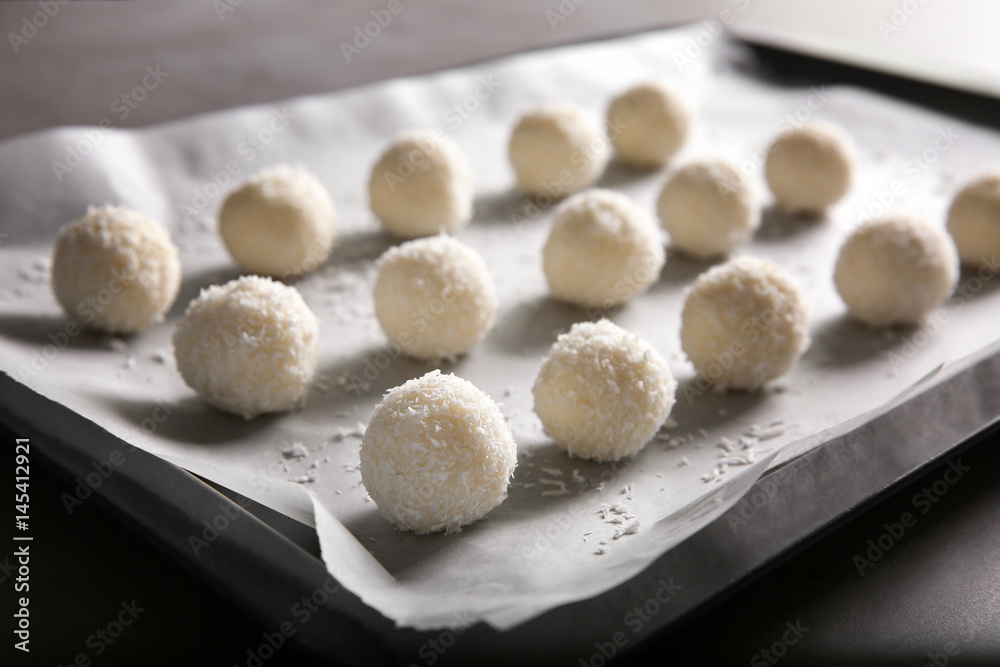 Baking tray with coconut candies, closeup