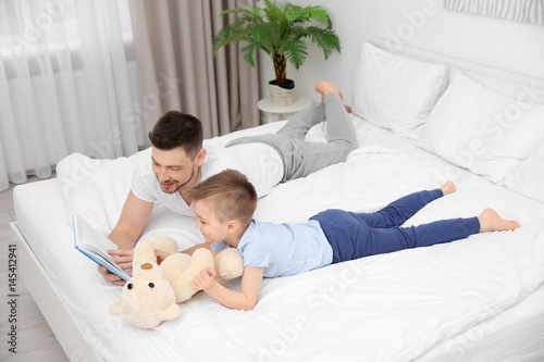 Dad and son reading interes...