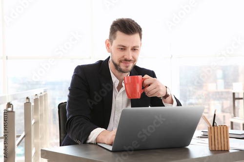 Young businessman working w...