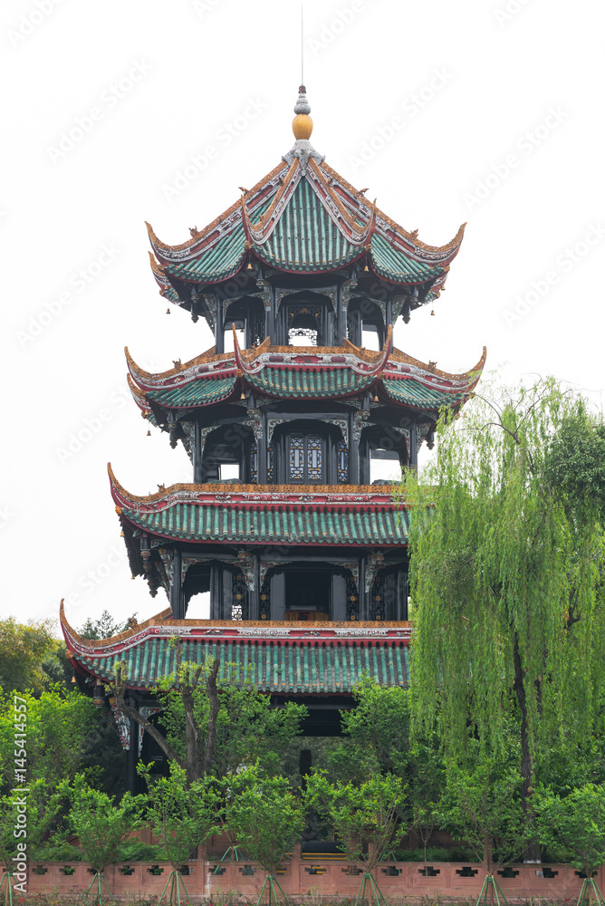 pagoda and trees against white sky