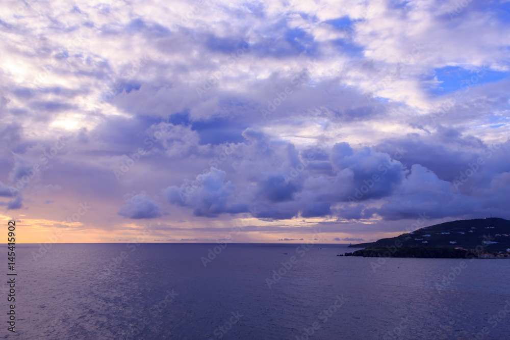 Beautiful sunset in St Maarten near island in caribbean sea Beautiful sunset in St Maarten near island in caribbean sea