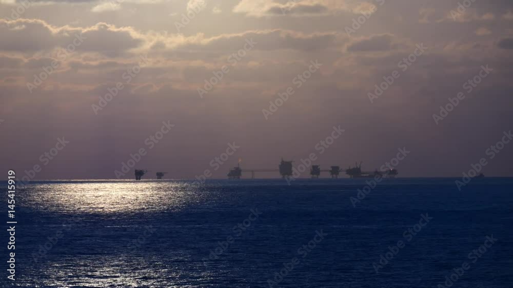 Central processing platform (cpp) in the middle of the ocean during sunset time - upstream industry
Central processing platform (cpp) in the middle of the ocean during sunset time - upstream industry
