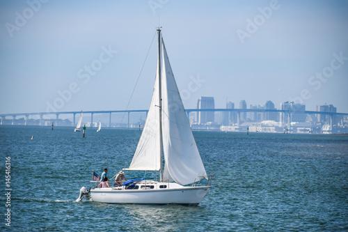Sailboat cruising at San Diego bay for weekend leisure