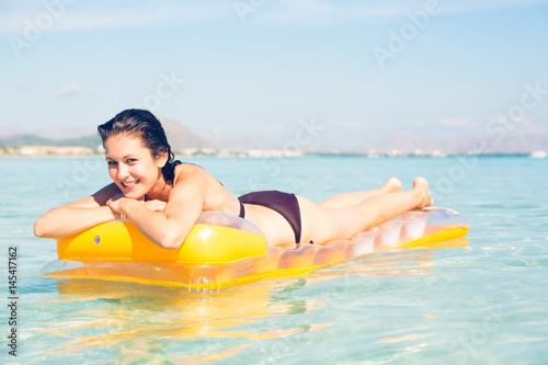 Young Woman With Pool Raft