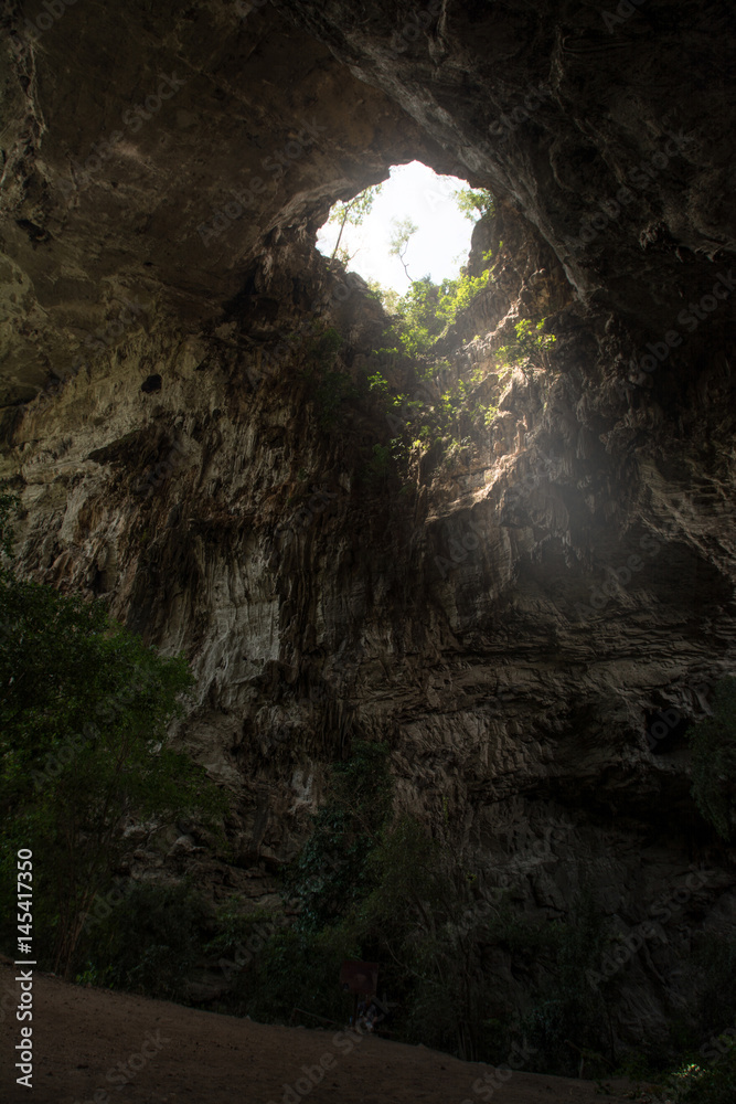 Sunlight shines through the Than Lot Yai Cave ( Chaloem Rattanakosin National Park ) , Kanchanaburi, Thailand Sunlight shines through the Than Lot Yai Cave ( Chaloem Rattanakosin National Park ) , Kanchanaburi, Thailand
