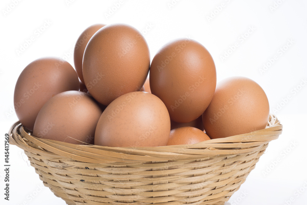 Eggs in the basket isolated on white background. Eggs in the basket isolated on white background.
