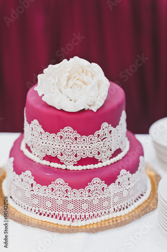 Pink with white decorations cake 7989.