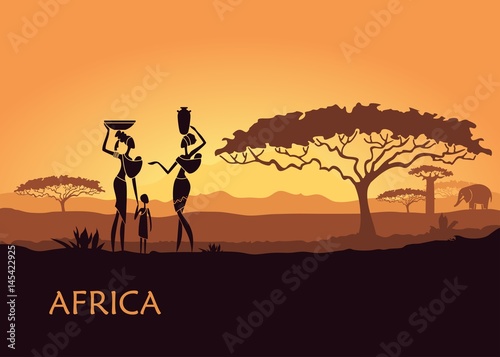 African woman on sunset background