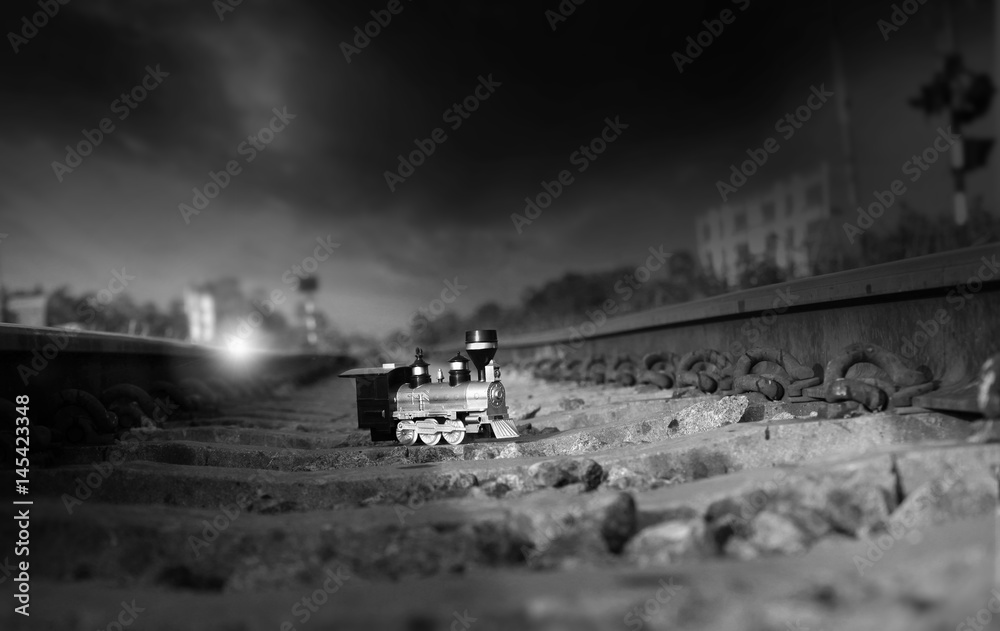 Vintage train toy model on rail.Shallow depth of field composition.