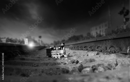 Vintage train toy model on rail.Shallow depth of field composition. © chokchaipoo