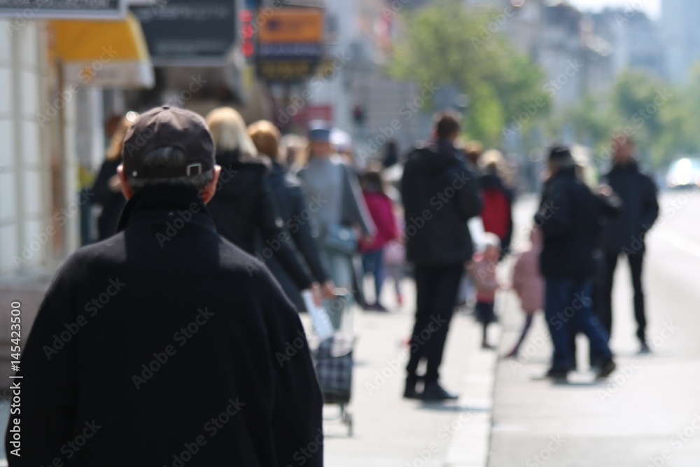 Blurred People walking in the street