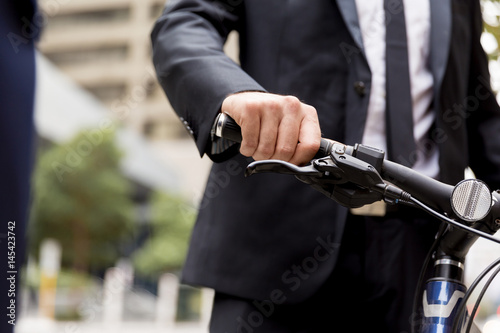 Young businessman with bike