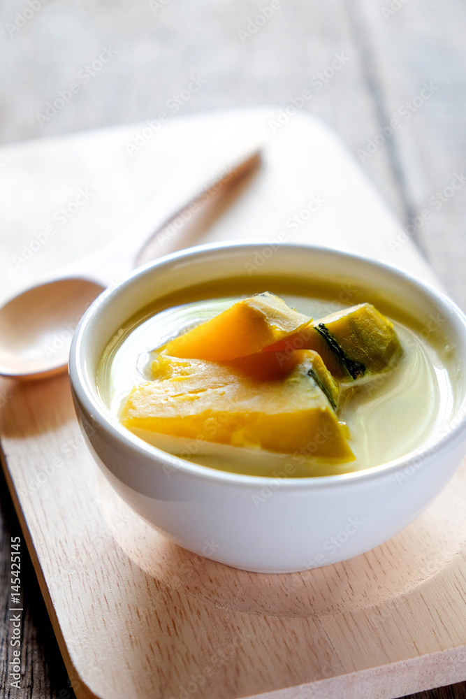 Thai style dessert, pumpkin sliced in sweet coconut milk. Thai style dessert, pumpkin sliced in sweet coconut milk.