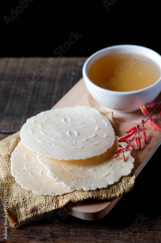 Coconut biscuits curl or Tong Muan, thai sweetmeat made of flour, coconut milk and egg.