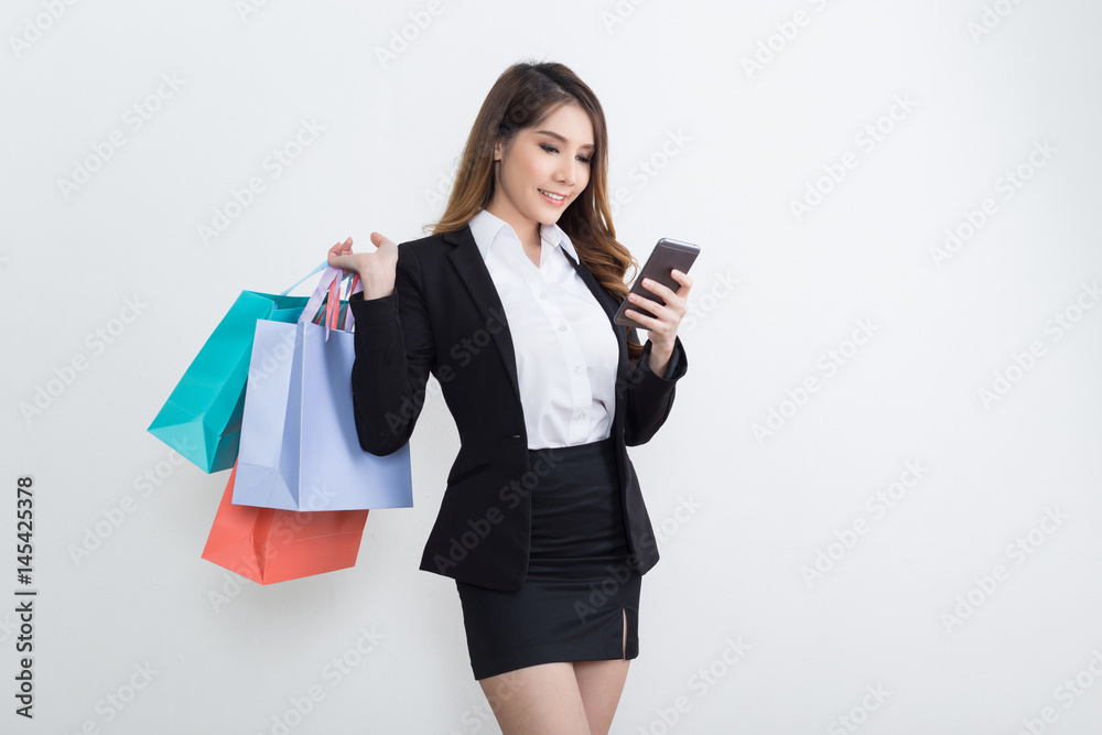 Beautiful businesswoman with shopping bags Beautiful businesswoman with shopping bags