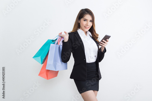 Beautiful businesswoman with shopping bags