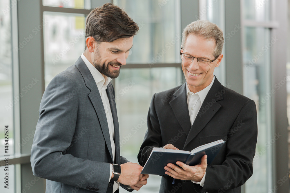 Stylish businessmen working in office Stylish businessmen working in office