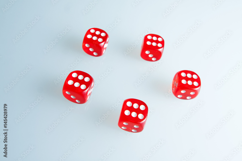 Red dice on the glass. Five dice with the value of Red dice on the glass. Five dice with the value of