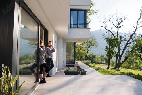 couple enjoying on the door of their luxury home villa © .shock
