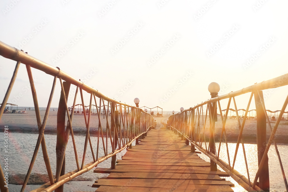 Naklejka premium Wooden bridge across the river