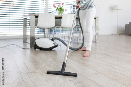 Attractive Female with Vacuum Cleaner