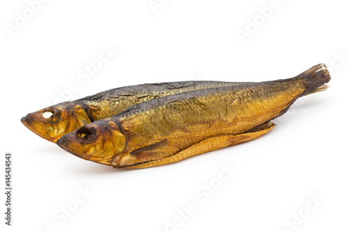 Smoked trout in front of a white background. © gitusik