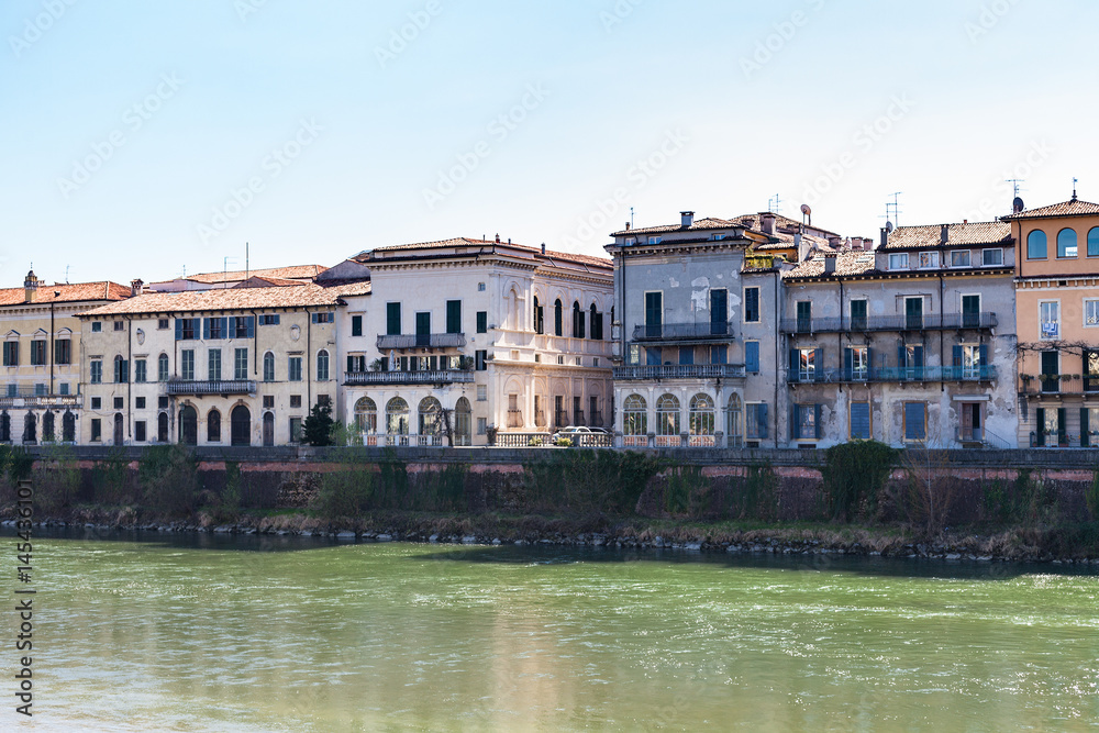 houses on waterfronts in Verona city in spring