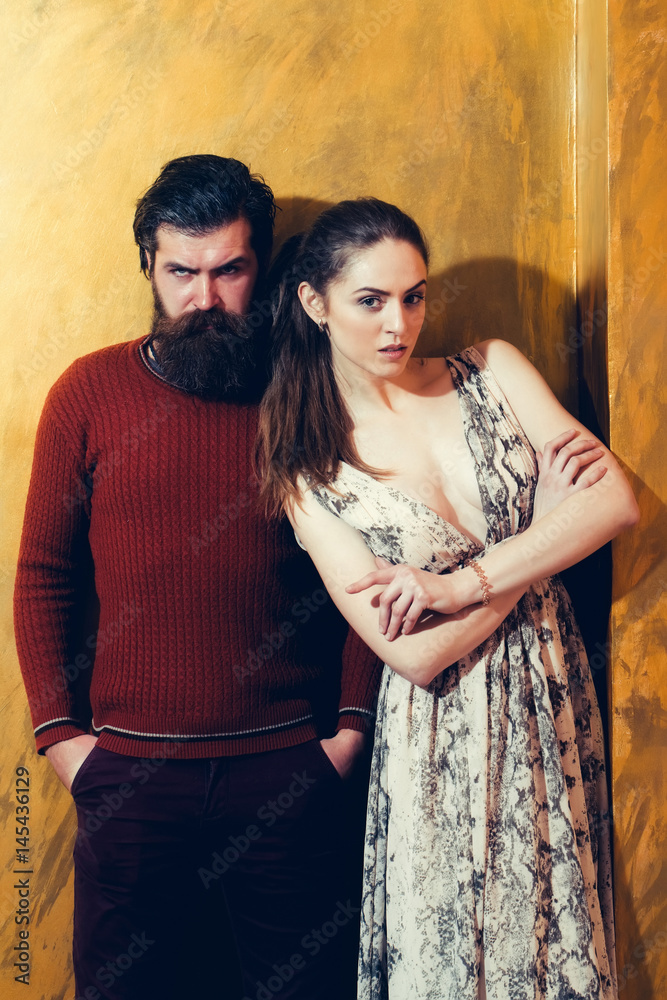 Pretty girl and serious bearded man with beard Pretty girl and serious bearded man with beard
