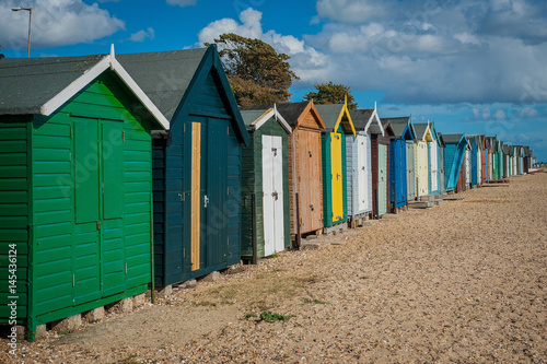 2016 United Kingdom Mersea colorful houses on the coast. Beautiful wide beach with interesting buildings © Filip