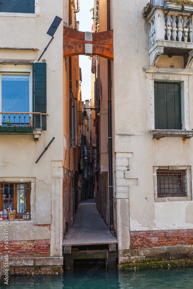 narrow street in Venice city in spring
