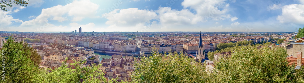 Huge wide Panorama summer view of the city, Lyon, France. With colorful blue sky and white clouds