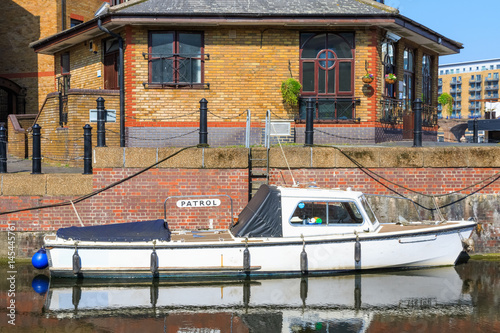 Patrol boat moored at Limehouse Basin Marina in London photo