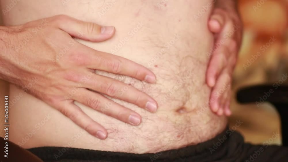 Man demonstrates his belly Man demonstrates his belly