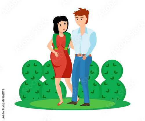 Young couple is walking in park, guy with pregnant girl.