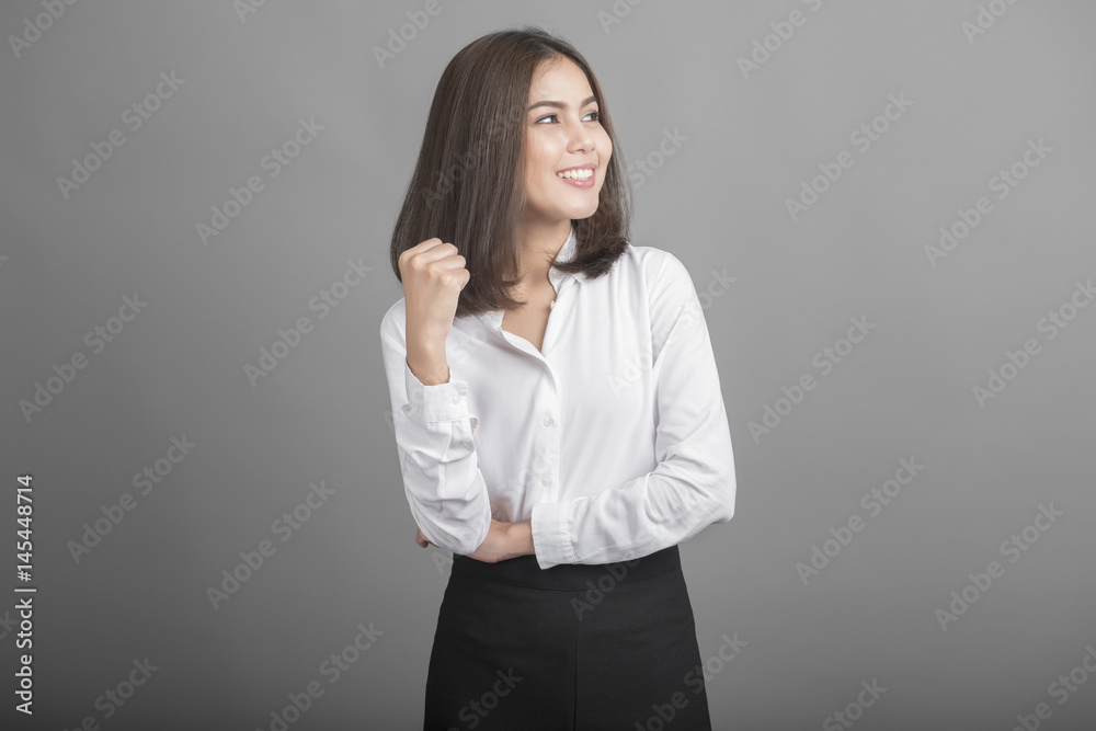 Beautiful Business Woman confident on grey background Beautiful Business Woman confident on grey background