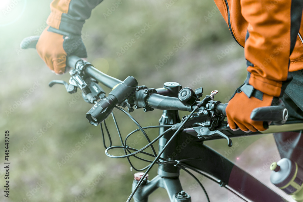 Equiped biker holds bike helm, sport ride concept Equiped biker holds bike helm, sport ride concept