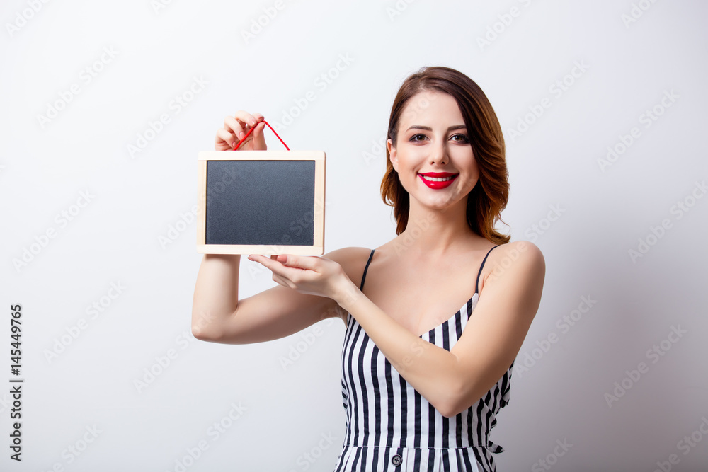 portrait of beautiful young woman with board on the wonderful white studio background portrait of beautiful young woman with board on the wonderful white studio background