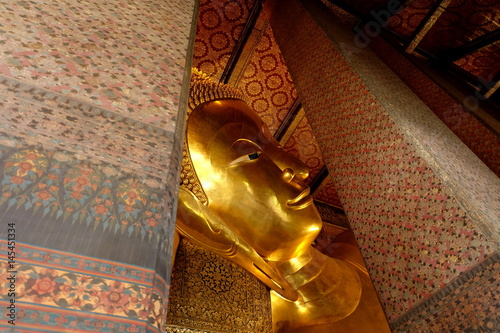 Ancient Reclining Buddha image inside Wat Pho. Wat Pho is famous temple and historical landmark of Thailand.