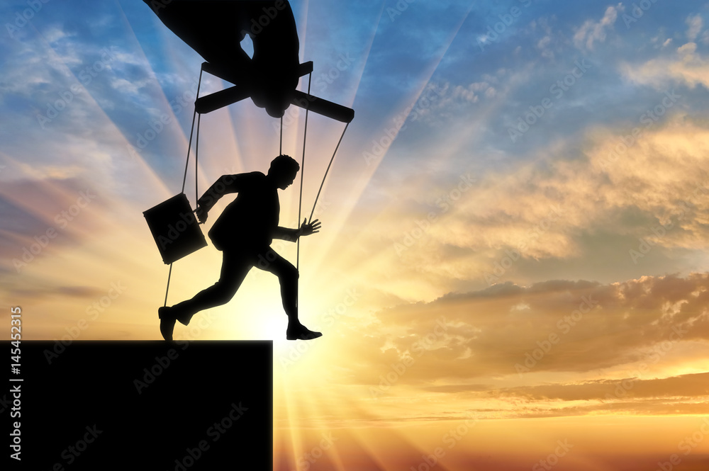 Fotografie Man marionette runs into abyss