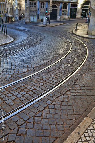 Old rail lines on cobbled road surface