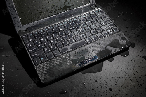 Laptop filled with water