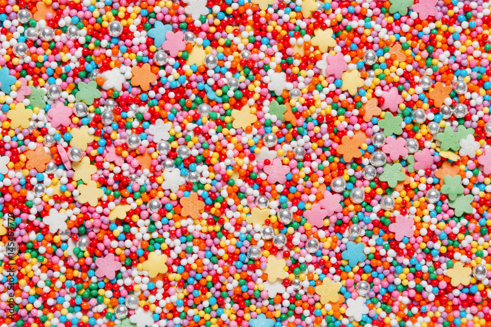 Colorful sweet background with sprinkles. Holiday treat. Cupcake and Ice cream topping. Sweet Texture. Sweet Background Colorful sweet background with sprinkles. Holiday treat. Cupcake and Ice cream topping. Sweet Texture. Sweet Background