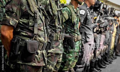Thai soldiers with gun.